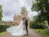 Couple kissing with Castle in the bakground