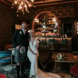 Couple posing in bar of Cornhill Castle