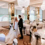 Couple in dining room before guests enter