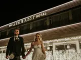 Couple standing in front of The Redhurst Hotel