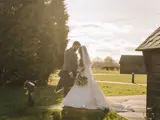 Bride and groom pose on the grounds of Bowfield Hotel & Spa, a micro wedding venue in Renfrewshire near Glasgow.