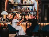 Couple sharing a drink at the bar after getting married