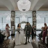 Couple walking down the aisle just married