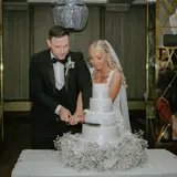 Couple cutting their wedding cake at Boclair House Hotel