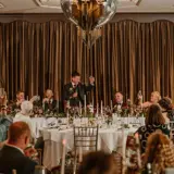 Groom giving speech at wedding