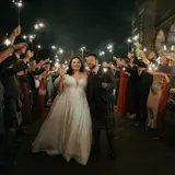 Couple walking through wedding party