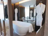 bathroom with robes hanging up