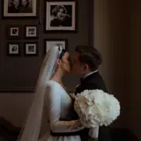 married couple kissing during wedding ceremony