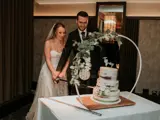 Couple getting ready to cut their cake