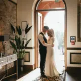 Couple sharing a moment at the rear entrance to Boclair House
