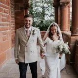 happily married bride and groom on balcony at boclair house