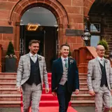Groom and groomsmen walking