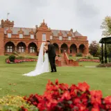 Couple kissing in the gardens of Boclair House