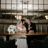 Couple kissing in booth
