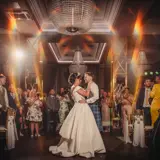 married couple having first dance around friends at boclair house