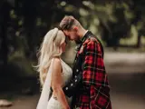 Couple share a moment outside castle